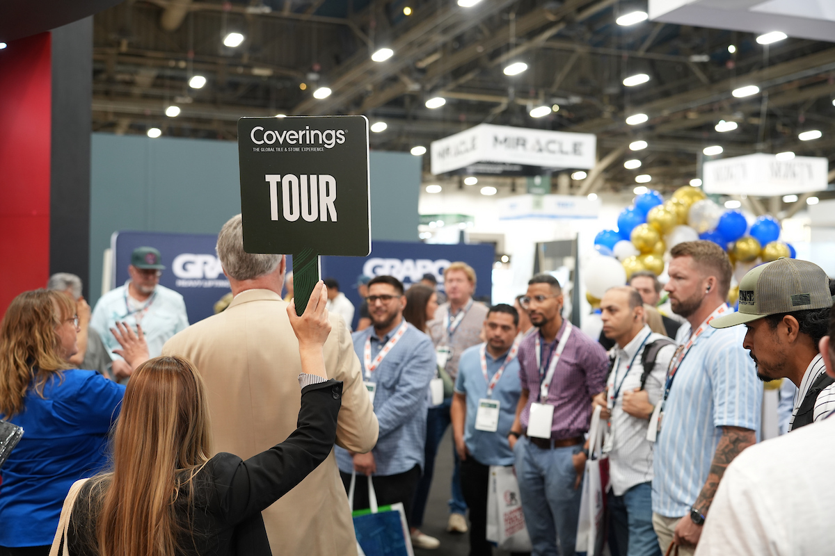 Coverings attendees exploring the show floor during a guided tour