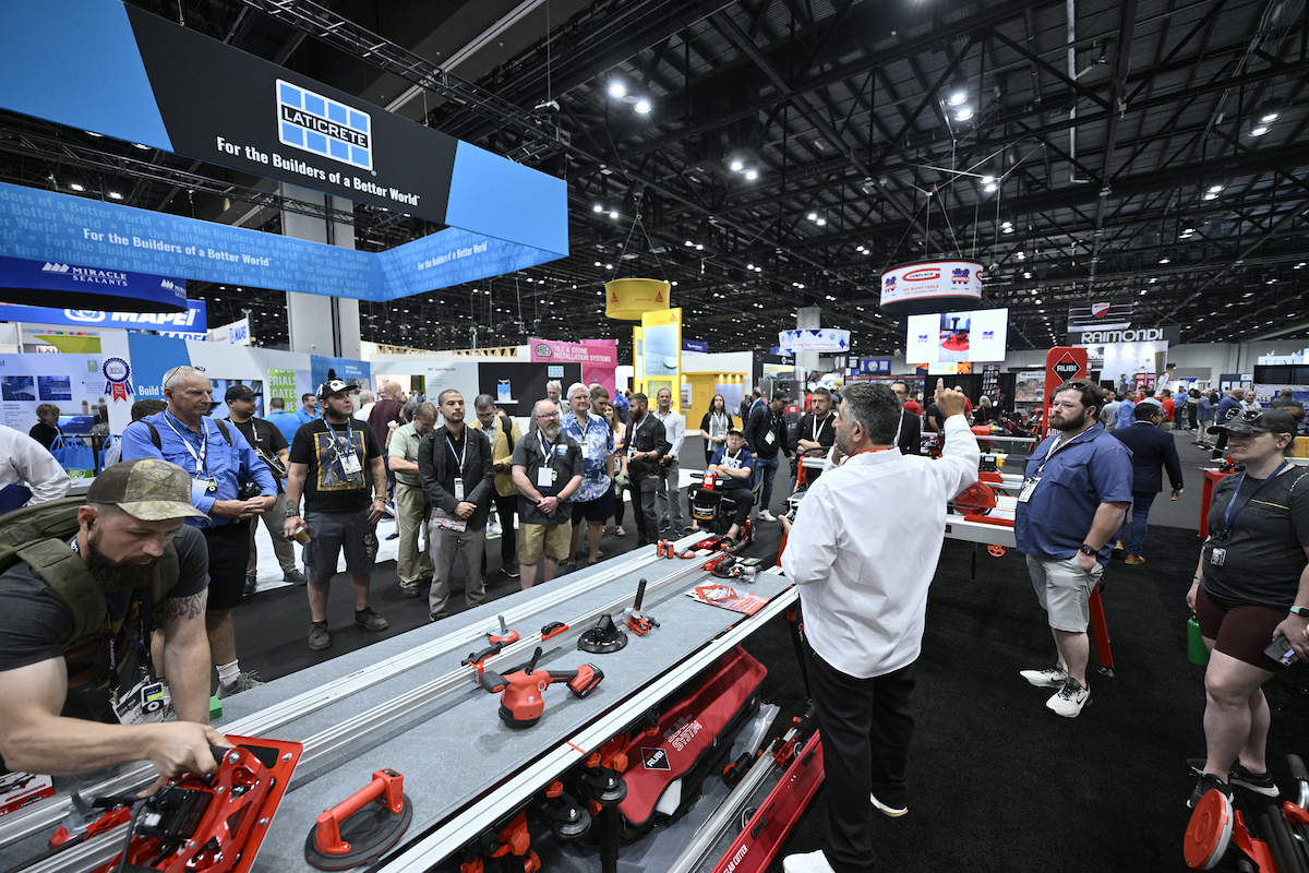 Coverings event attendees exploring tile and stone exhibits