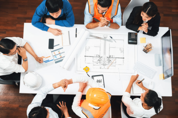 Construction workers looking over a blueprint